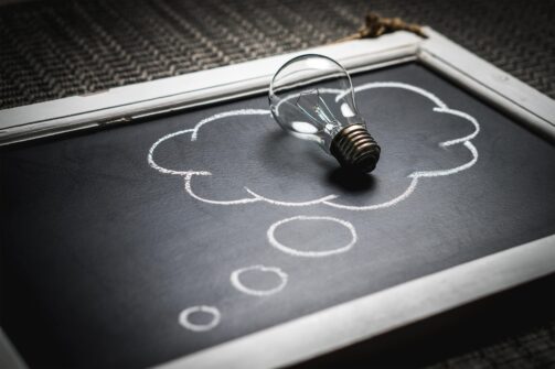 lightbulb placed on blackboard